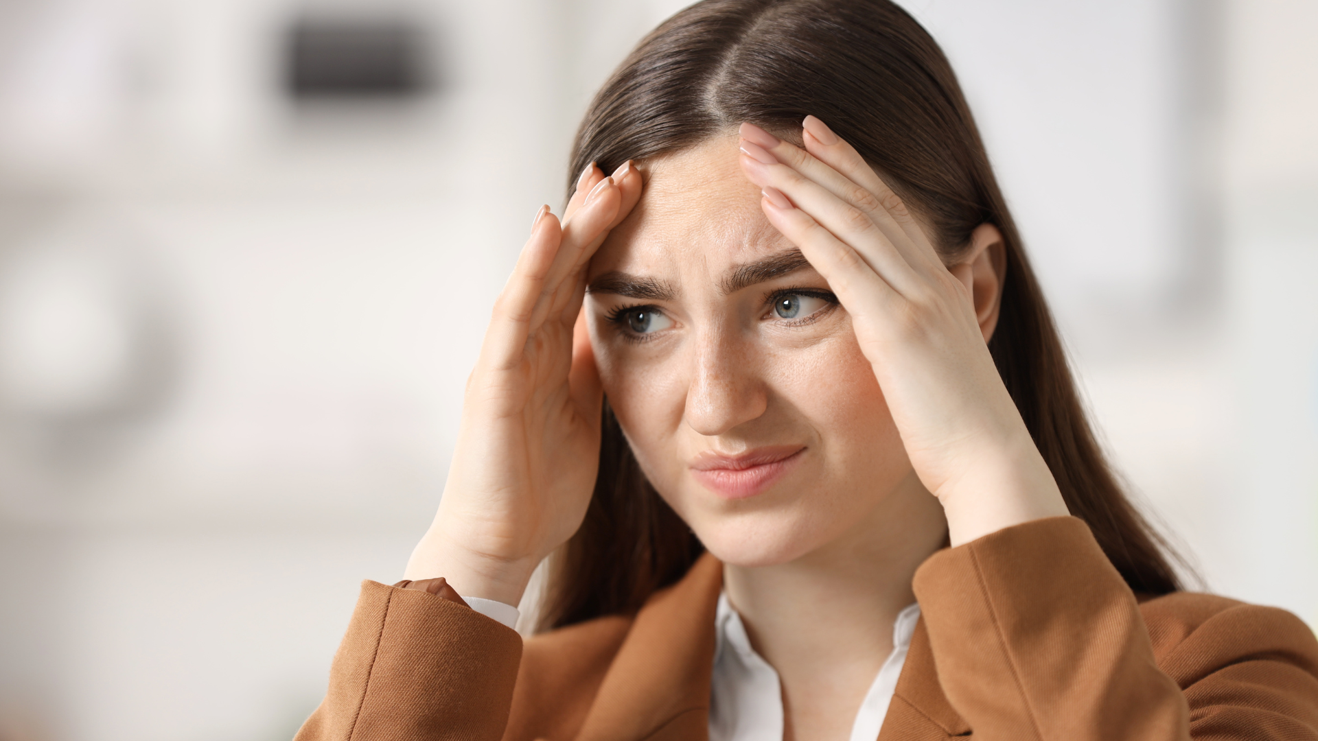 Woman looking stressed about making mistakes while learning English